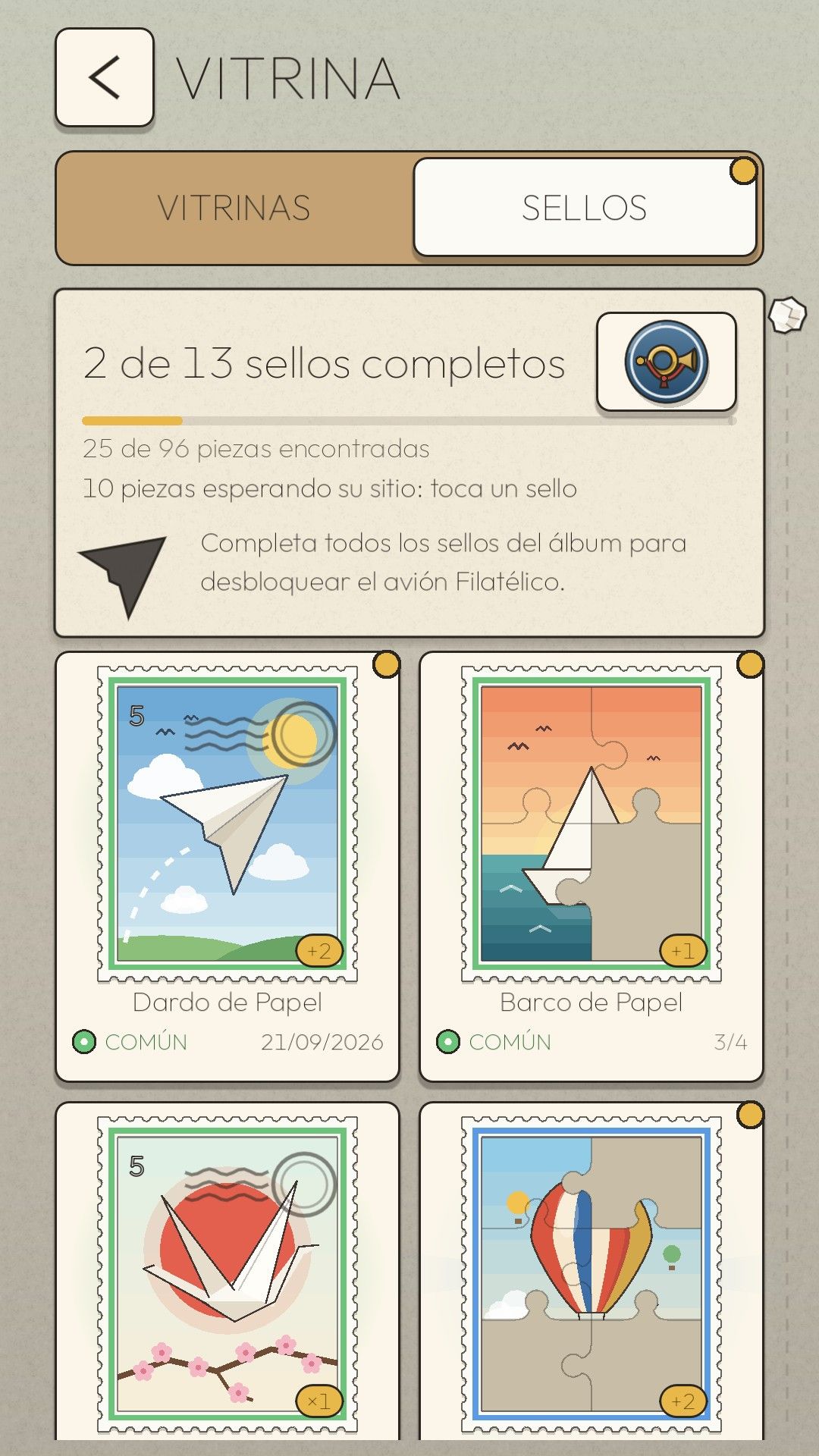 El álbum de sellos de Paper Drift con 2 de 13 sellos completos: Dardo de Papel, Barco de Papel, Grulla de Papel y Día de Globos