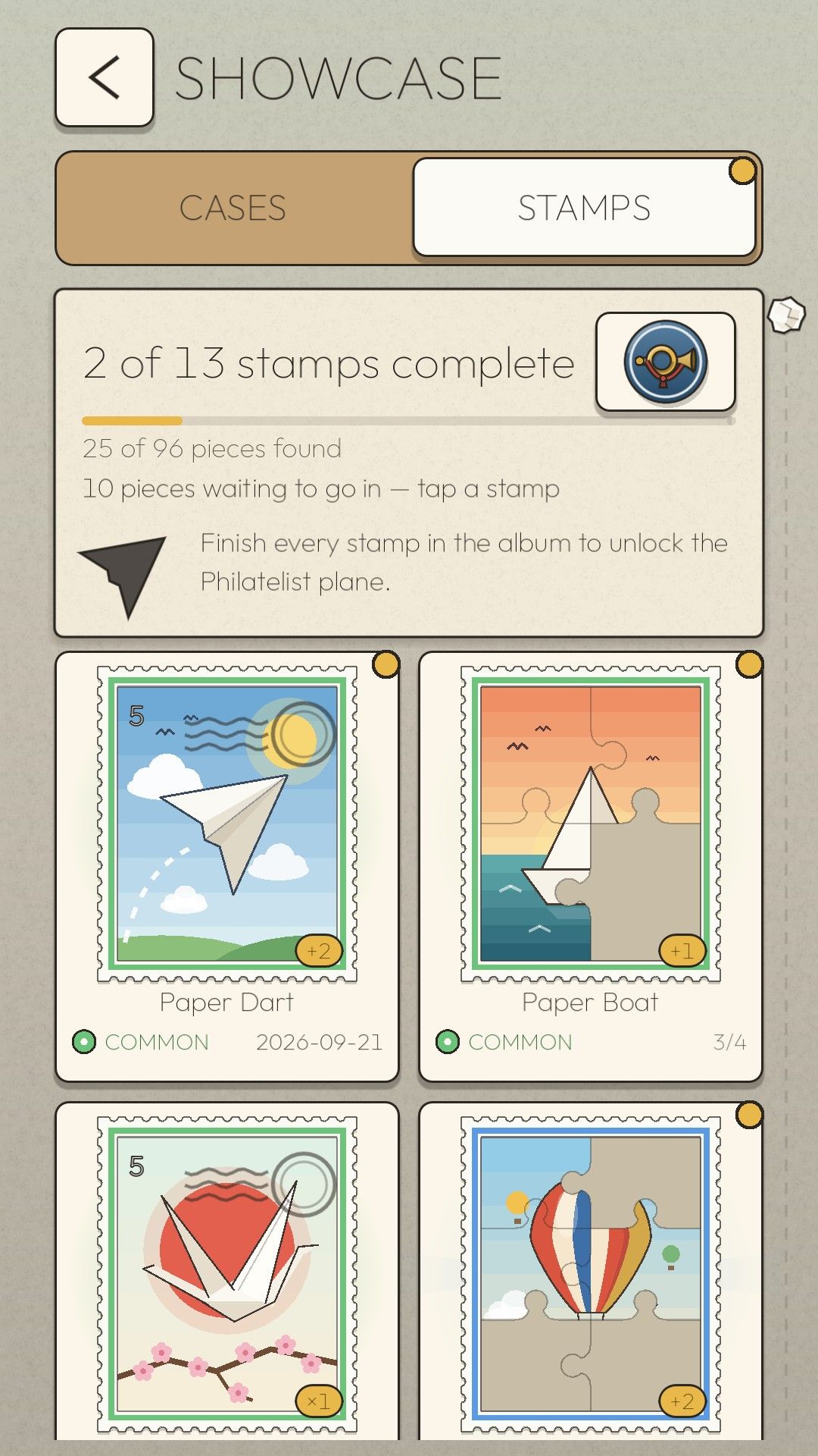 The Paper Drift stamp album showing 2 of 13 stamps complete, with the Paper Dart, Paper Boat, Folded Crane and Balloon Day stamps