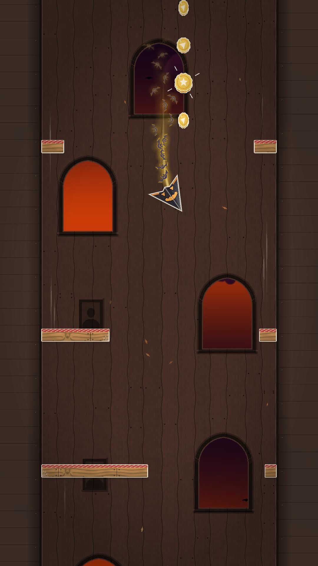 A jack-o'-lantern paper plane with a trail of bats passes gold coins between wooden girders in the haunted manor