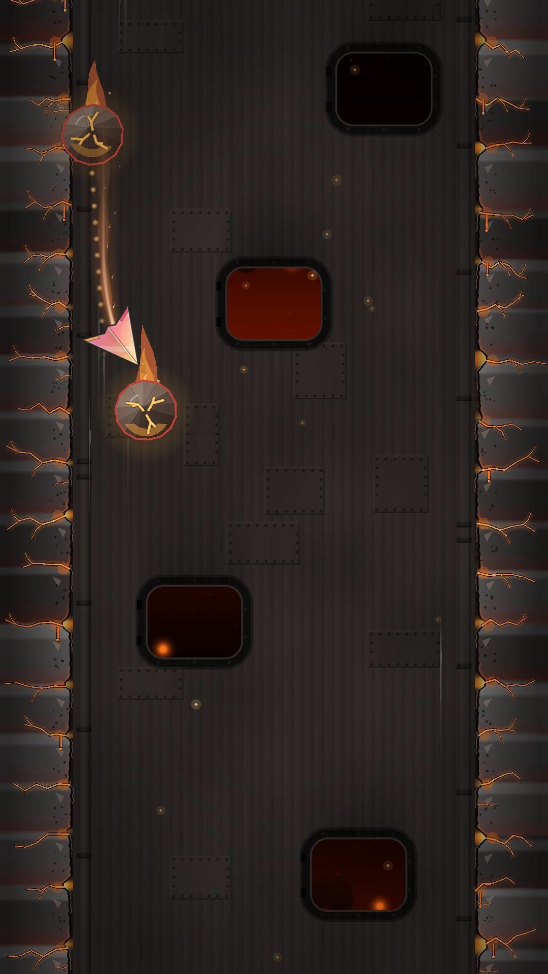 A paper plane near the Foundry's left wall slips between two molten rocks, one of them bouncing off the wall