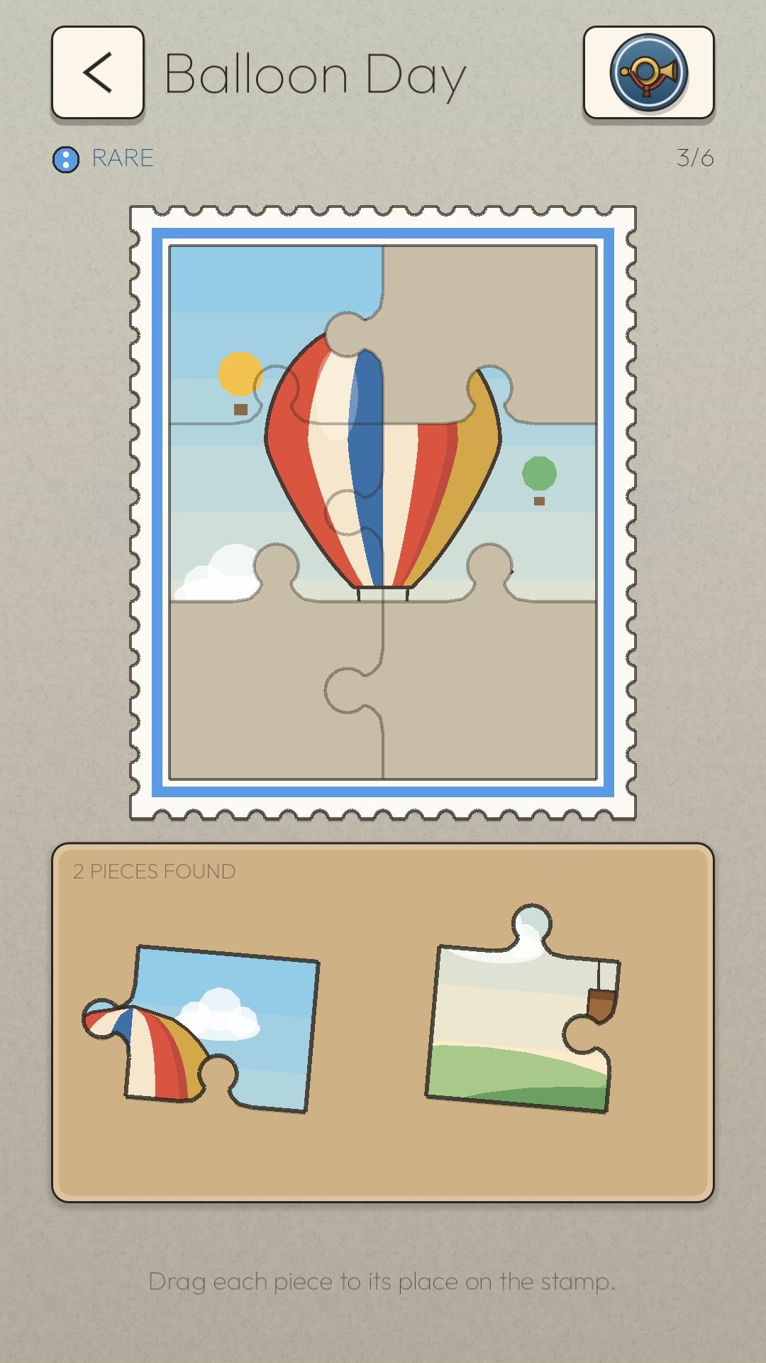 A hot-air balloon stamp being put together like a jigsaw puzzle